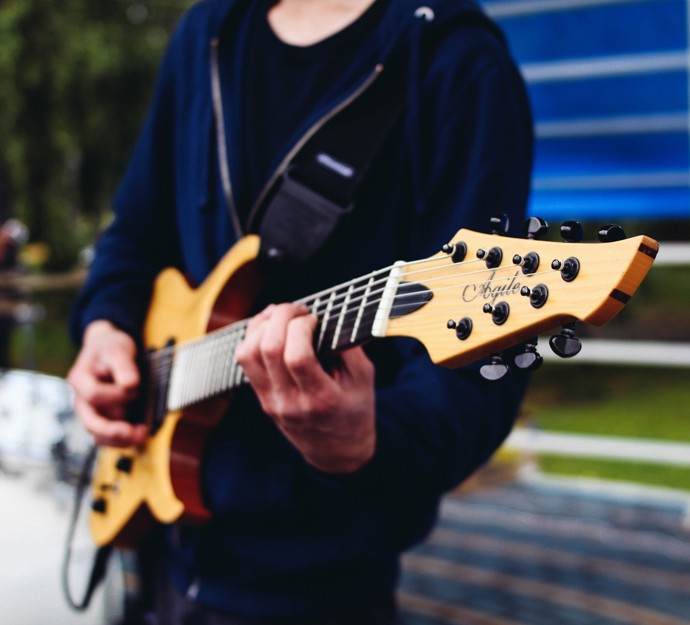Person playing electrical guitar